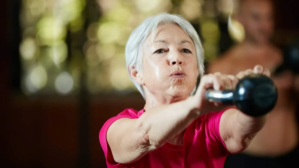 Toning Bingo Wings: Effective Exercises and Tips for Achieving Sleeker Arms 2 Person performing arm exercises with dumbbells Wimborne
